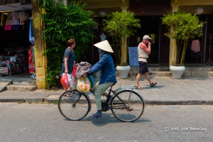 Woman on Bicycle in Market