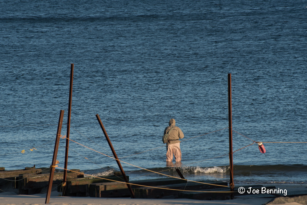 A fisherman between the Posts and in the Water