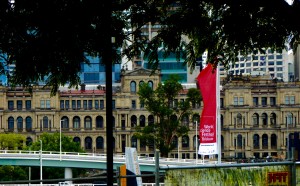 View of the old Treasury Building as seen from the South Bank of the River.   This building is now an operating casino (ironic, eh?).  Note the banner advertising the World Science Festival to be held soon in Brisbane, and the large newer office towers in the background.  