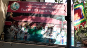 Banner for the Water Puppet Show in Saigon - an old art in which the puppets are manipulated by people behind a curtain, who have sticks connected to the puppets to make them move; very skillful work! 