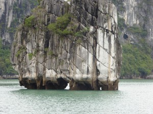 Ha Long Bay - close up of one of the limestone formations and its caves