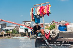 Trader Displays Her Wares in Floating Market of the Mekong River