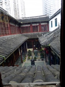 interior courtyard of the temple; note the clay roof tiles and the high rise buildings in the background - this temple is surrounded by buildings and construction