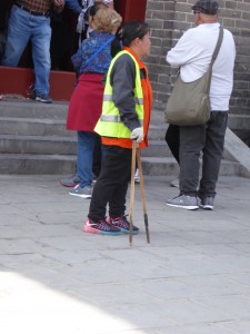 a maintenance lady at the Great Wall - I thought her tool looked like chopsticks