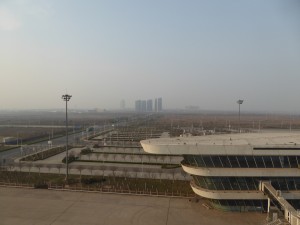 back to the ship at 4pm and look at the smog that has settled over the area (Beijing is over 200 miles away); that structure in the foreground is a wing of the terminal building