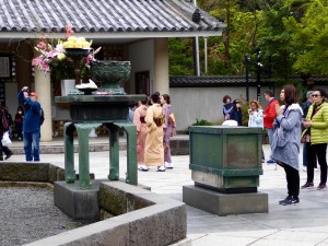 At Kamakura (outside Tokyo) we saw the Great Buddha, and young ladies in traditional dress who joined others worshipping before Buddha 