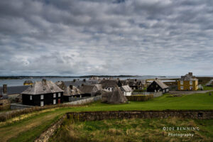 Small Village under a Cloudy, Dramatic Sky
