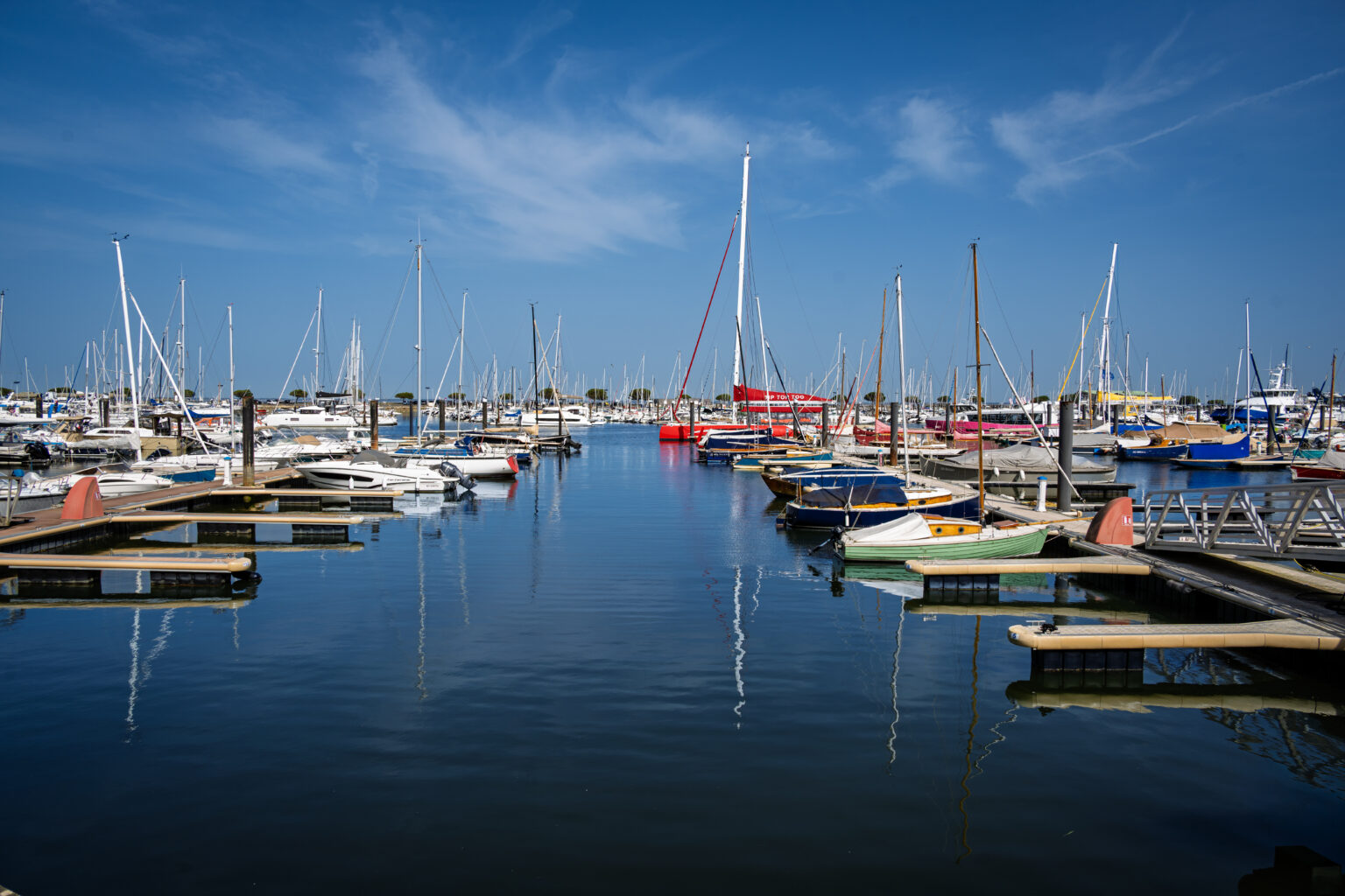 Calm marina filled with sailboats on the Basque Coast