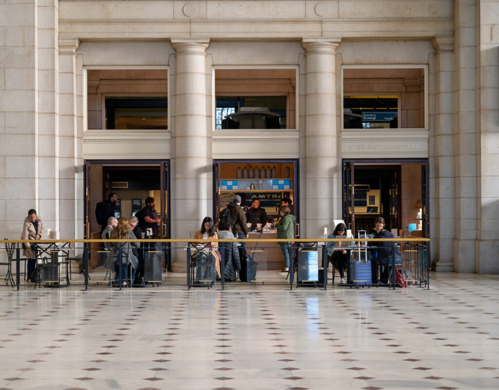Customers gather at a café inside the monumental main hall of Union Station in Washington, DC.