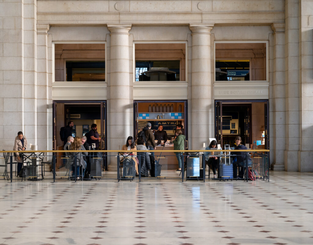 Customers gather at a caf&eacute; inside the monumental main hall of Union Station in Washington, DC.