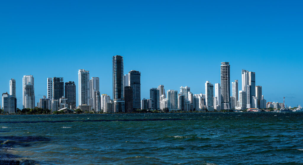 Cartagena waterfront towers stretching across the horizon beyond rippled blue water.