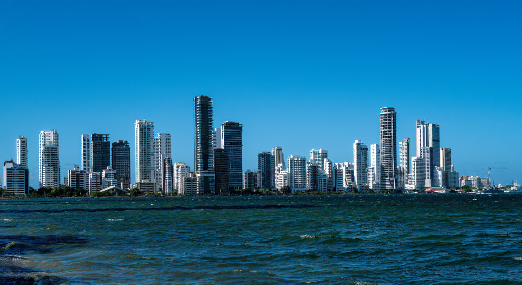 Cartagena waterfront towers stretching across the horizon beyond rippled blue water.