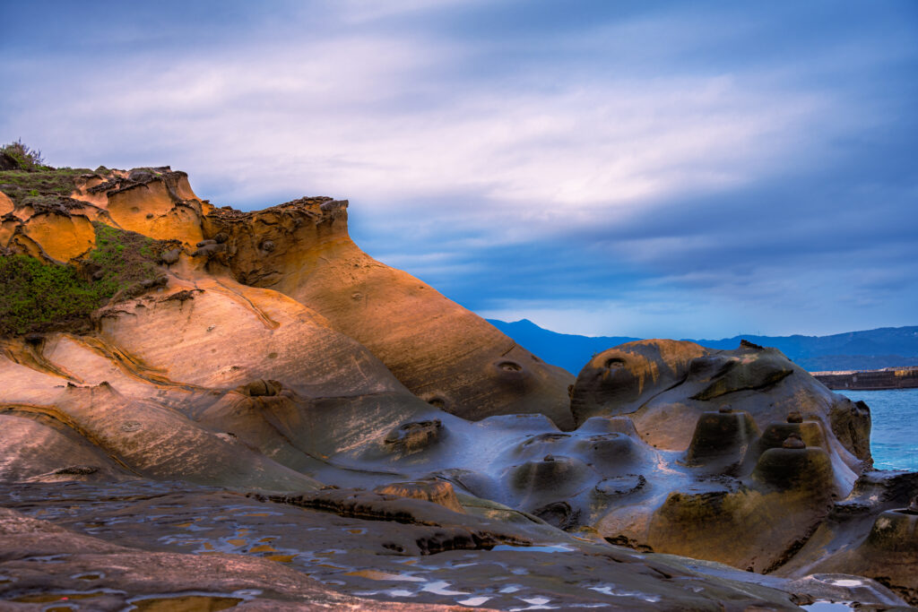Weathered sandstone rises above the sea at Yehliu on Taiwan&rsquo;s northern coast.